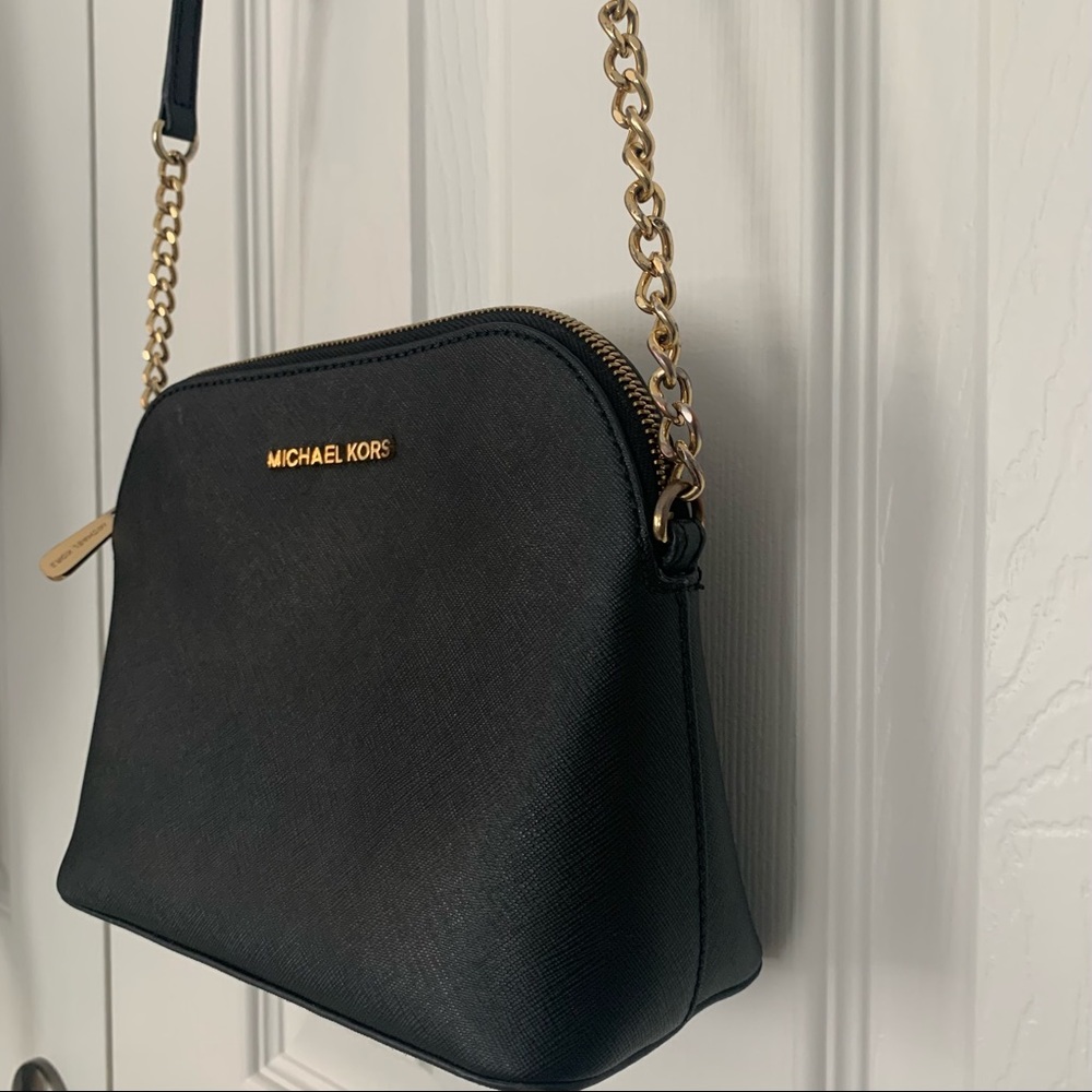 Micheal Kors Black Crossbody Bag. Good accents